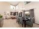 Spacious living room and dining room featuring high ceilings and plenty of natural light at 9170 Fox Fire Dr, Highlands Ranch, CO 80129