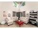 Bright living room with soaring ceilings, comfortable seating, and abundant natural light at 9170 Fox Fire Dr, Highlands Ranch, CO 80129