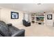 Cozy entertainment room with comfortable seating and built-in shelving at 9170 Fox Fire Dr, Highlands Ranch, CO 80129