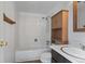 Bathroom featuring a combination tub and shower with wood look medicine cabinet and vanity at 1901 Clear Creek Dr # F104, Georgetown, CO 80444