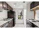 Modest kitchen featuring laminate counters, white walls, and dark cabinetry at 1901 Clear Creek Dr # F104, Georgetown, CO 80444