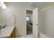 Sparkling bathroom with tile floors and a view into the bedroom at 12281 E Tennessee Dr # 302, Aurora, CO 80012