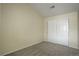 Empty bedroom features soft carpet, neutral paint, and a double closet at 12281 E Tennessee Dr # 302, Aurora, CO 80012