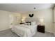 Inviting bedroom with soft carpet, neutral paint and a well-lit ensuite bathroom at 12281 E Tennessee Dr # 302, Aurora, CO 80012