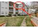Exterior view of the condo building, showing the well-maintained lawn and partial view of a private balcony at 12281 E Tennessee Dr # 302, Aurora, CO 80012