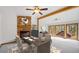 Cozy office featuring a brick fireplace, built-in shelving, and scenic backyard views at 612 Nob Hill Trl, Franktown, CO 80116