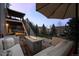 Backyard patio with stone flooring, fire pit, and outdoor seating at 7862 Stonedale Dr, Castle Pines, CO 80108