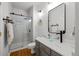 Modern bathroom with a glass shower, vessel sink, and stylish fixtures at 7862 Stonedale Dr, Castle Pines, CO 80108