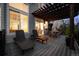 Outdoor deck with lounge chairs and pergola-covered table at 7862 Stonedale Dr, Castle Pines, CO 80108