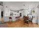 Well-lit kitchen with modern appliances, a breakfast bar, and an adjacent dining area for easy entertaining at 7862 Stonedale Dr, Castle Pines, CO 80108