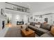 Spacious living room featuring a fireplace, an open layout, and seamless transitions to the kitchen at 7862 Stonedale Dr, Castle Pines, CO 80108