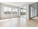 Bright dining room with large windows and sliding door to covered patio at 1840 Morgan Dr, Erie, CO 80516