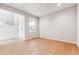 Bright flex room with wood floors, a large window, and modern neutral paint at 1840 Morgan Dr, Erie, CO 80516