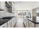 Modern kitchen with stainless appliances, sleek countertops, and center island at 1840 Morgan Dr, Erie, CO 80516