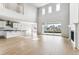 Bright living room with soaring ceilings, fireplace and large sliding glass doors to let in natural light at 1840 Morgan Dr, Erie, CO 80516