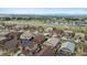 An aerial view of a neighborhood showcasing well-maintained homes and landscaping with mountain views in the distance at 7790 S Queensburg Way, Aurora, CO 80016