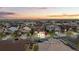 An aerial view captures the residential neighborhood, revealing expansive landscapes at 7790 S Queensburg Way, Aurora, CO 80016