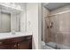 Modern bathroom featuring a glass shower, vanity, and neutral color palette at 7790 S Queensburg Way, Aurora, CO 80016
