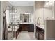 Modern bathroom with dual sinks, walk-in shower, large tub and closet at 7790 S Queensburg Way, Aurora, CO 80016