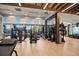 State-of-the-art fitness center equipped with modern exercise machines and natural light, ideal for health and wellness at 7790 S Queensburg Way, Aurora, CO 80016