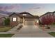 Charming home featuring a well-maintained lawn and an inviting front porch at 7790 S Queensburg Way, Aurora, CO 80016