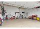 Spacious garage with room for vehicles and storage, ideal for organization at 7790 S Queensburg Way, Aurora, CO 80016