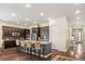 Spacious kitchen with granite countertops, stainless steel appliances, and a large center island at 7790 S Queensburg Way, Aurora, CO 80016