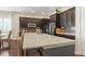 Modern kitchen featuring granite countertops, a stainless steel refrigerator, and a center island with seating at 7790 S Queensburg Way, Aurora, CO 80016