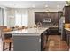 Bright kitchen with a granite island and stainless steel appliances at 7790 S Queensburg Way, Aurora, CO 80016
