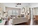Spacious living room with fireplace, modern ceiling fans and stylish, neutral-toned furniture at 7790 S Queensburg Way, Aurora, CO 80016