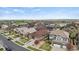 A scenic street view of a residential neighborhood with manicured lawns at 7790 S Queensburg Way, Aurora, CO 80016