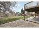 Lush backyard featuring a concrete patio and deck, perfect for outdoor living at 11285 Ranch Pl, Denver, CO 80234