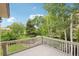 Spacious deck overlooking lush greenery, perfect for outdoor entertaining and relaxing at 11285 Ranch Pl, Denver, CO 80234