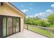 Outdoor balcony access with wooded view and siding at 11285 Ranch Pl, Denver, CO 80234