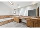 Large bathroom featuring dual sinks and a soaking tub at 11285 Ranch Pl, Denver, CO 80234