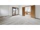 Large bedroom featuring a sliding glass door to the exterior and bathroom access at 11285 Ranch Pl, Denver, CO 80234