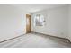 Bedroom featuring a window with curtains, closet and carpet flooring at 11285 Ranch Pl, Denver, CO 80234