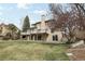 The back of this house features a multi-level deck and patio, perfect for outdoor living and entertaining at 11285 Ranch Pl, Denver, CO 80234