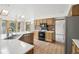 Well-equipped kitchen with white countertops, stainless steel appliances, and ample cabinet space with wood flooring at 11285 Ranch Pl, Denver, CO 80234