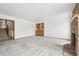 Spacious living room featuring neutral carpet, wet bar, and stair access at 11285 Ranch Pl, Denver, CO 80234