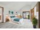 Spacious main bedroom features vaulted ceilings, slider access to balcony, and ensuite bath at 11285 Ranch Pl, Denver, CO 80234