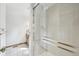 Walk-in shower featuring tiled walls and glass door at 11285 Ranch Pl, Denver, CO 80234