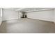 Spacious finished basement with neutral carpet, recessed lighting, and a wet bar in the corner at 2391 Hudson St, Denver, CO 80207