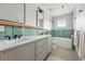 Bright bathroom featuring double sinks, a modern tub, stylish tile, and contemporary fixtures at 2391 Hudson St, Denver, CO 80207