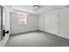 Bright bedroom with neutral carpet, window, and large closet for ample storage at 2391 Hudson St, Denver, CO 80207