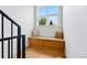 Cozy nook features built-in wooden seating with bright window and scenic view at 2391 Hudson St, Denver, CO 80207