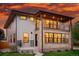 Striking two-story home featuring mixed siding, large windows, and a balcony perfect for enjoying scenic views at 2391 Hudson St, Denver, CO 80207