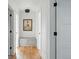 Hallway with art and bench seating at 2391 Hudson St, Denver, CO 80207