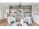 Elegant living room showcasing a stylish shelving display with contemporary furniture and natural light at 2391 Hudson St, Denver, CO 80207