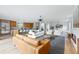 Spacious living room showcasing an open layout, modern furnishings, and stylish decor elements, with hardwood floors at 2391 Hudson St, Denver, CO 80207